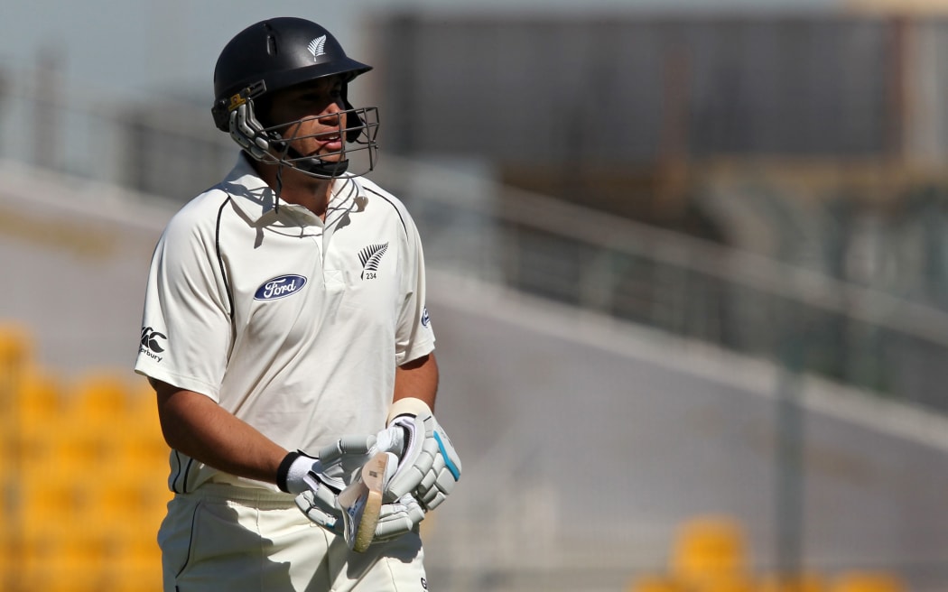 Ross Taylor walks back to the pavilion after his unbeaten 77