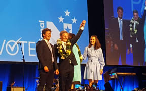 Bill English with his son Xavier, wife Mary (hidden) and daughter Maria.