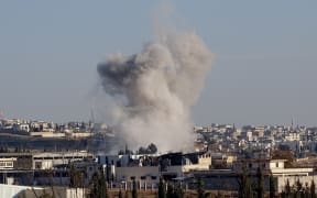 Smoke rises after Russian airstrikes in Aleppo on February 9.