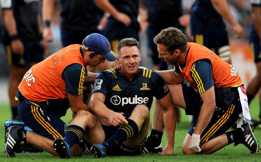 Ben Smith gets medical attention during the Highlanders match against the Chiefs.