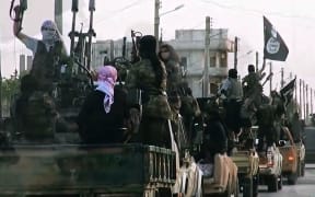 An image from an Islamic State video released in March 2014 shows fighters in the Syrian city of Homs.