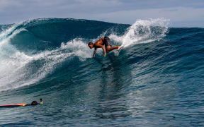 A Surfer training days out from Billabong's annual Tahiti competition at Teahupoo reef. TAHITI, FRENCH POLYNESIA - AUGUST 5 2018