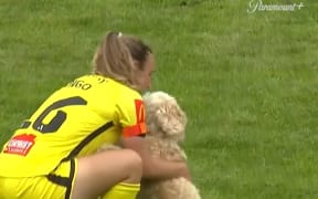 Wellington Phoenix captain Annalie Longo and her dog at Porirua Park during the team's round 2 clash with Canberra United.