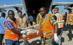 UN staff medics help wounded civilians at Mogadishu airport in Somali after a bombing by al Shabaab. 29  February, 2016.