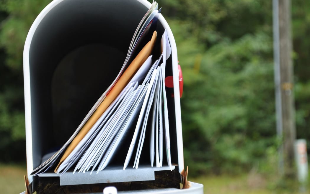 Letterbox full of mail. letterbox generic