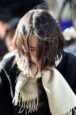 Heather Cho arrives for questioning at the prosecutors' office in Seoul in December