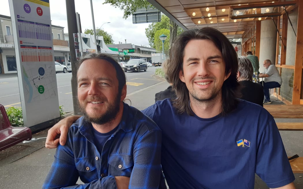Marc (left) and Ben Lavers from Auckland enjoying a coffee in Hamilton - and happy to have a stranger say 'hello'.