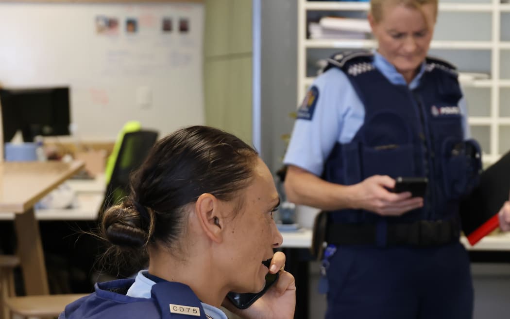 Constable Yvonne Tremain in Hastings makes calls to contact people following Cyclone Gabrielle.