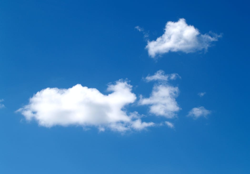 An image of a blue sky with some clouds.