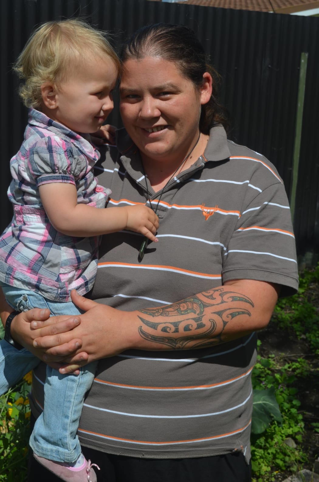 Kaylene Tahuhu in the garden at St Marks with her god-daughter Charlotte