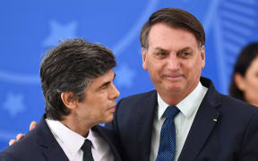 Nelson Teich, left, and  Brazilian President  Jair Bolsonaro during his swearing-in ceremony less than a month ago