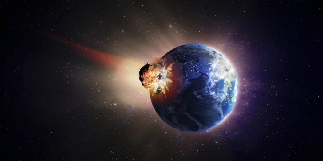 A very large asteroid hitting Earth (Photo by Mopic / AWO / Science Photo Library via AFP)