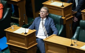 Paul Goldsmith sits and listens to a speech during the first reading of the Treaty Principles Bill on 14 November.