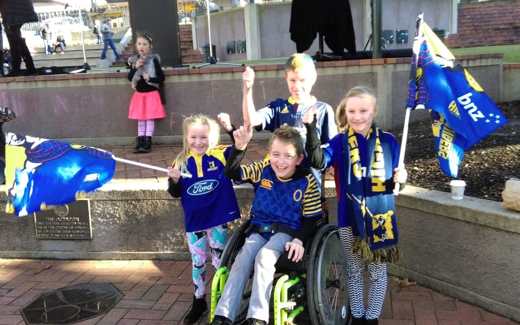 Jalen, (8), (at rear) Gemma(7), Dylan(11, seated) Sienna (7) are among the hundreds of supporters already in the Octagon.