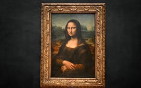 This photograph shows the painting "La Joconde" (the Mona Lisa) by Italian artist Leonardo Da Vinci at the Louvre Museum in Paris on 28 January 2025. (Photo by Bertrand GUAY / AFP) / RESTRICTED TO EDITORIAL USE - MANDATORY MENTION OF THE ARTIST UPON PUBLICATION - TO ILLUSTRATE THE EVENT AS SPECIFIED IN THE CAPTION