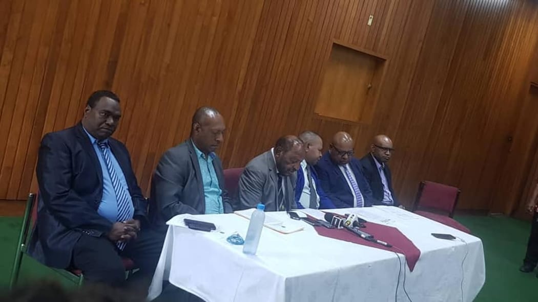 The five members of Papua New Guinea's government who have resigned.