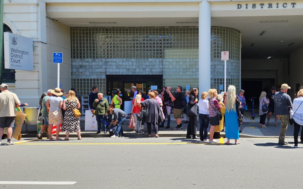 Barry Young's supporters gather outside Wellington District Court to congratulate him on his not guilty plea on 18 December 2023.