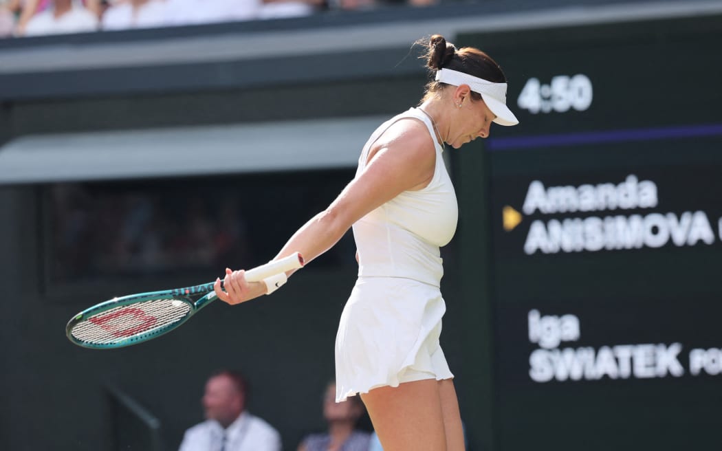 Amanda Anisimova of the United States reacts during ladies' singles final match against Iga Swiatek of Poland on day thirteen of the Wimbledon Championships at the All England Lawn Tennis and Croquet Club in London, on July 12, 2025.      ( The Yomiuri Shimbun ) (Photo by Daisuke Urakami / The Yomiuri Shimbun via AFP)