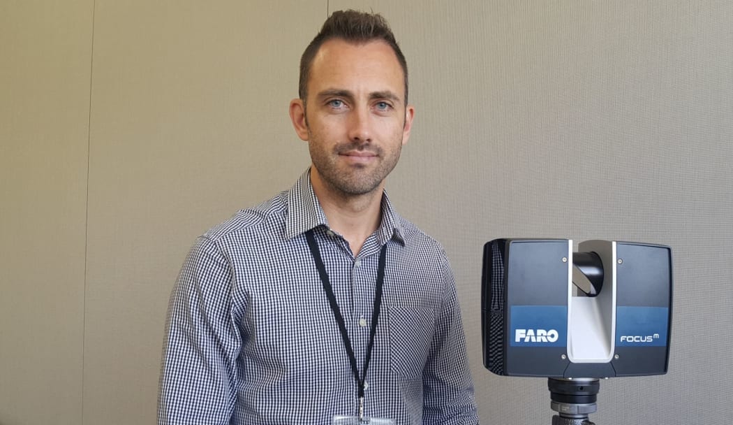ESR forensic investigator Kurt McManus with a laser scanner.