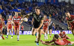 New Zealand's Joseph Manu heads in for a try against Lebanon - 2022 World Cup.