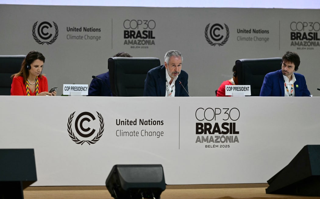COP30 President Andre Correa do Lago (C) speaks during a plenary session of the COP30 UN Climate Change Conference in Belem, Para state, Brazil on November 21, 2025. Colombia said Friday that the UN climate talks "cannot end" without a roadmap for the global phaseout of fossil fuels after it was omitted from the latest draft agreement unveiled by COP30 host Brazil. (Photo by Pablo PORCIUNCULA / AFP)