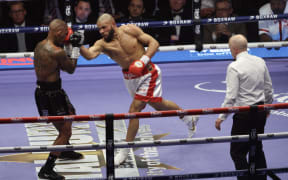 Britain's Chris Eubank Jr throws a punch against Britain's Conor Benn during their middleweight boxing match at the Tottenham Hotspur stadium in London on 16 April, 2025.  (Photo by Darren Staples / AFP)