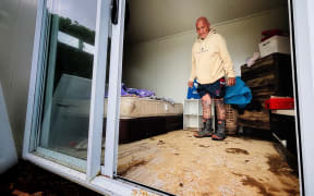 Inside one of the cabins, now caked in mud