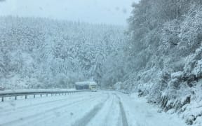 A truck on the snow-covered Blackmount-Redcliff Rd, near Monowai, Southland.