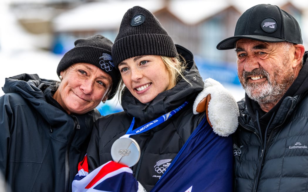 Zoi Sadowski-Synnott with her family after winning silver medal at the final of the Women's Snowboard Slopestyle, Winter Olympics, 2026.