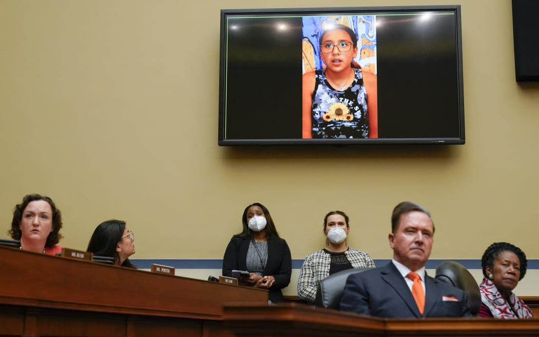 Miah Cerrillo, a fourth grade student at Robb Elementary School in Uvalde, Texas, and survivor of the mass shooting appears on a screen during a House Committee on Oversight and Reform hearing on gun violence on Capitol Hill in Washington, DC, on 8 June 2022.