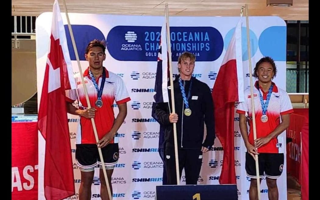 Team Tonga swimmers on the medal podium in Brisbane