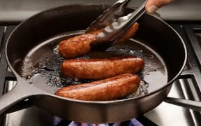 vegan sausages in a pan