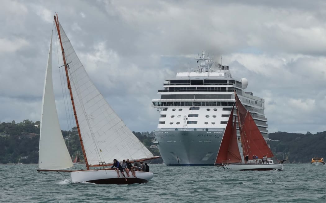 The 1936 mullet boat Corona, left, and the gaff-rigged Balaena pass the Seven Seas Explorer off Tapeka Point.