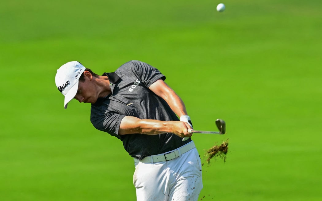 New Zealand's Daniel Hillier plays a shot from the fairway at the fifth hole on day two of the DP World Tour Championship 2025 at Jumeirah Golf Estates in Dubai on November 14, 2025. (Photo by Giuseppe CACACE / AFP)