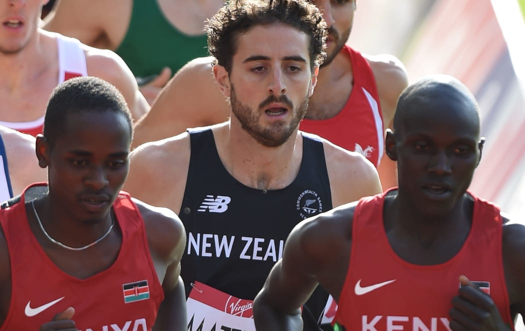 Julian Matthews (centre) contests the 1500m heats at the Glasgow Commonwealth Games.
