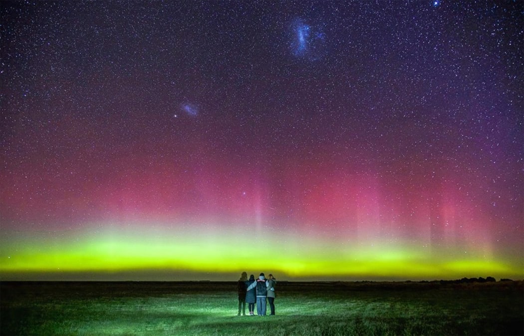 Mark Takerei and his family watch the Aurora Australis near Motukarara, south of Christchurch.
