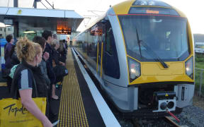 Commuters wait to board a south-bound train. A new timetable at the end of the year is expected to boost weekend services.