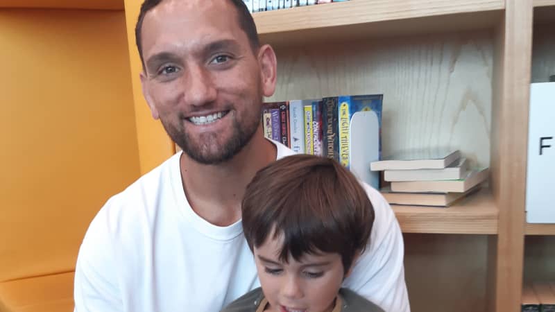 Former All Black Aaron Cruden with son Cooper aged 4 enjoy Wriggle and Rhyme at Te Kete Aronui Rototuna Library in Hamilton.