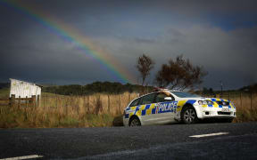 A crashed police car remains on the side of Ngamokai Road as the hunt for Dolphy Kohu continues.