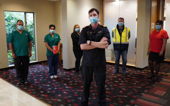 Staff at the Waipuna Hotel, Mt Wellington, Auckland. Several asked for their full names to be protected: (from left) nurses John and Vicki; workforce coordinator Tash, managed isolation facility manager Lieutenant Sam Wilson, site security manager Stuart. and hotel manager Shakira.
