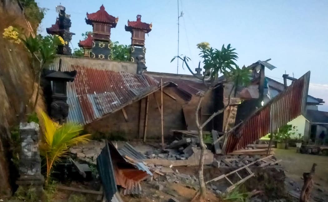 This handout picture taken and released on October 16, 2021 by the Bali regional disaster management agency (BPBD) shows collapsed houses after a 4.8 earthquake occurred in Karangasem, on the tourist island of Bali.