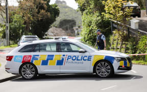 A police car is seen at blocking the road in Miramar, Wellington on 16 October, 2023, where a person was found dead at a residential address.