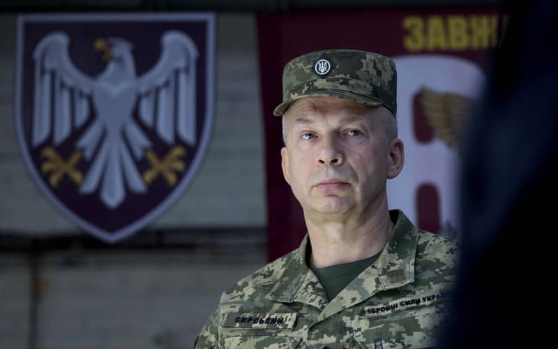 (FILES) This handout photograph taken and released by the Ukrainian Presidential Press Service on October 4, 2024, shows Commander-in-Chief of the Armed Forces of Ukraine Oleksandr Syrsky visiting the 82nd Air Assault Brigade at an undisclosed location in the Sumy region, amid the Russian invasion of Ukraine. Ukrainian President Volodymyr Zelensky said on July 21, 2026 that he was dismissing Oleksandr Syrsky, commander-in-chief of Ukraine’s army, and appointing joint forces commander Mykhailo Drapaty in his place. (Photo by Handout / UKRAINIAN PRESIDENTIAL PRESS SERVICE / AFP) / XGTY / RESTRICTED TO EDITORIAL USE - MANDATORY CREDIT “AFP PHOTO / UKRAINIAN PRESIDENTIAL PRESS SERVICE” - NO MARKETING NO ADVERTISING CAMPAIGNS - DISTRIBUTED AS A SERVICE TO CLIENTS