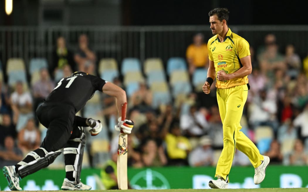 Mitctell Starc of Australia celebrtates the wicket of Martin Guptill of New Zealand, Chappell-Hadlee series, 2022.