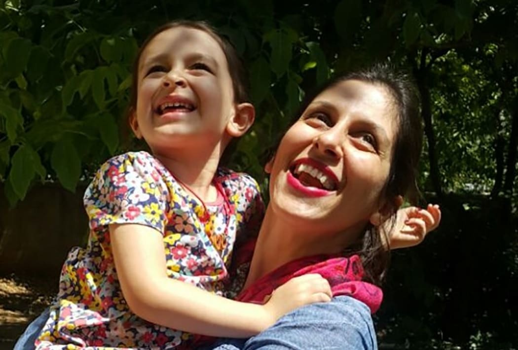 (FILES) This file handout picture released by the Free Nazanin campaign on August 23, 2018 shows Nazanin Zaghari-Ratcliffe (R) embracing her daughter Gabriella in Damavand, Iran following her release from prison for three days.