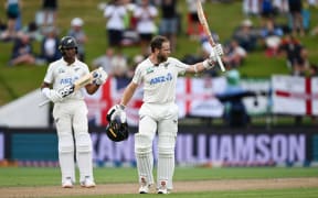 New Zealand's Kane Williamson celebrates his century during play of the third cricket test between New Zealand and England at Seddon Park in Hamilton.