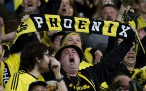 A Phoenix fan yells support during a match at Westpac Stadium in Wellington.