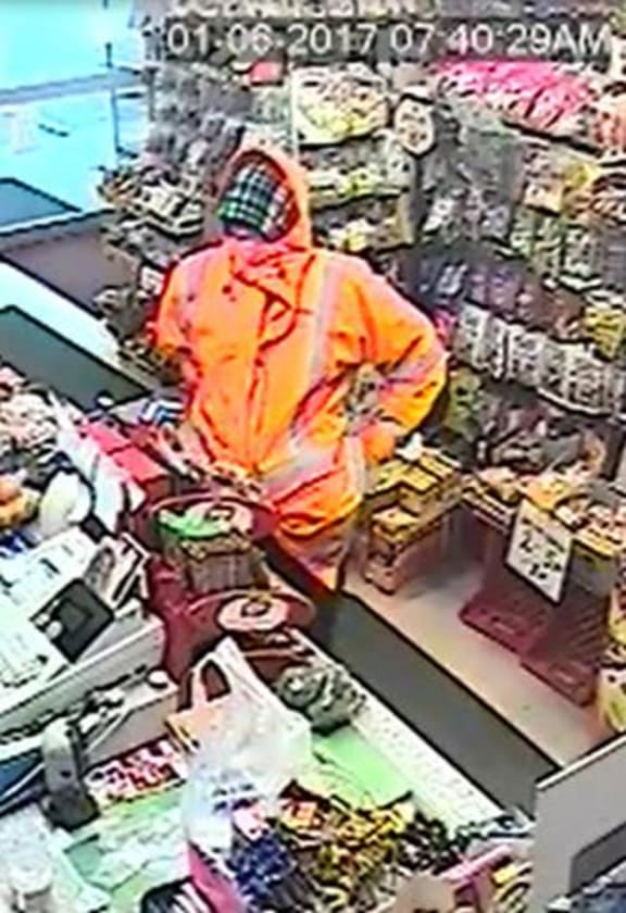 Police described the robber as Caucasian, wearing black shoes, black pants, and orange 'high-vis" raincoat.
