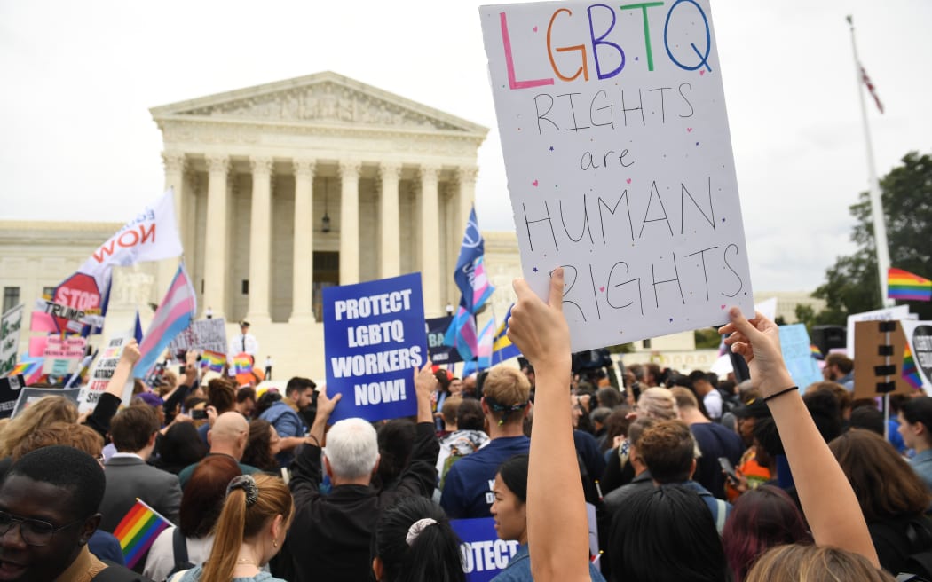 Demonstrators in favour of LGBT rights rally outside the US Supreme Court in Washington, DC, October 8, 2019, as the Court holds oral arguments in three cases dealing with workplace discrimination based on sexual orientation. (Photo by SAUL LOEB / AFP)