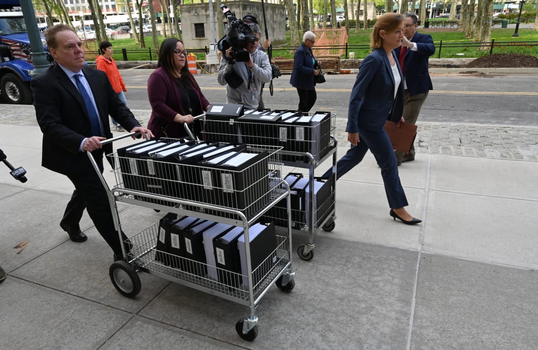 Members of the prosecution in the Nxivm case arrive with documents at Brooklyn Federal Court on May 7, 2019.